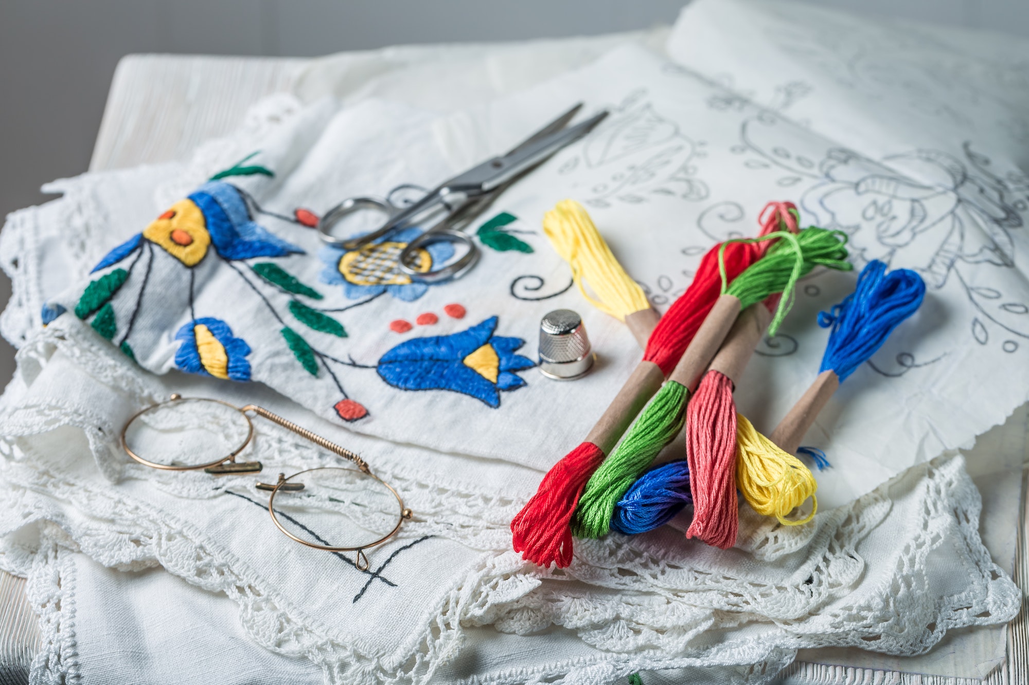 Closeup of color mulina and embroidered napkins